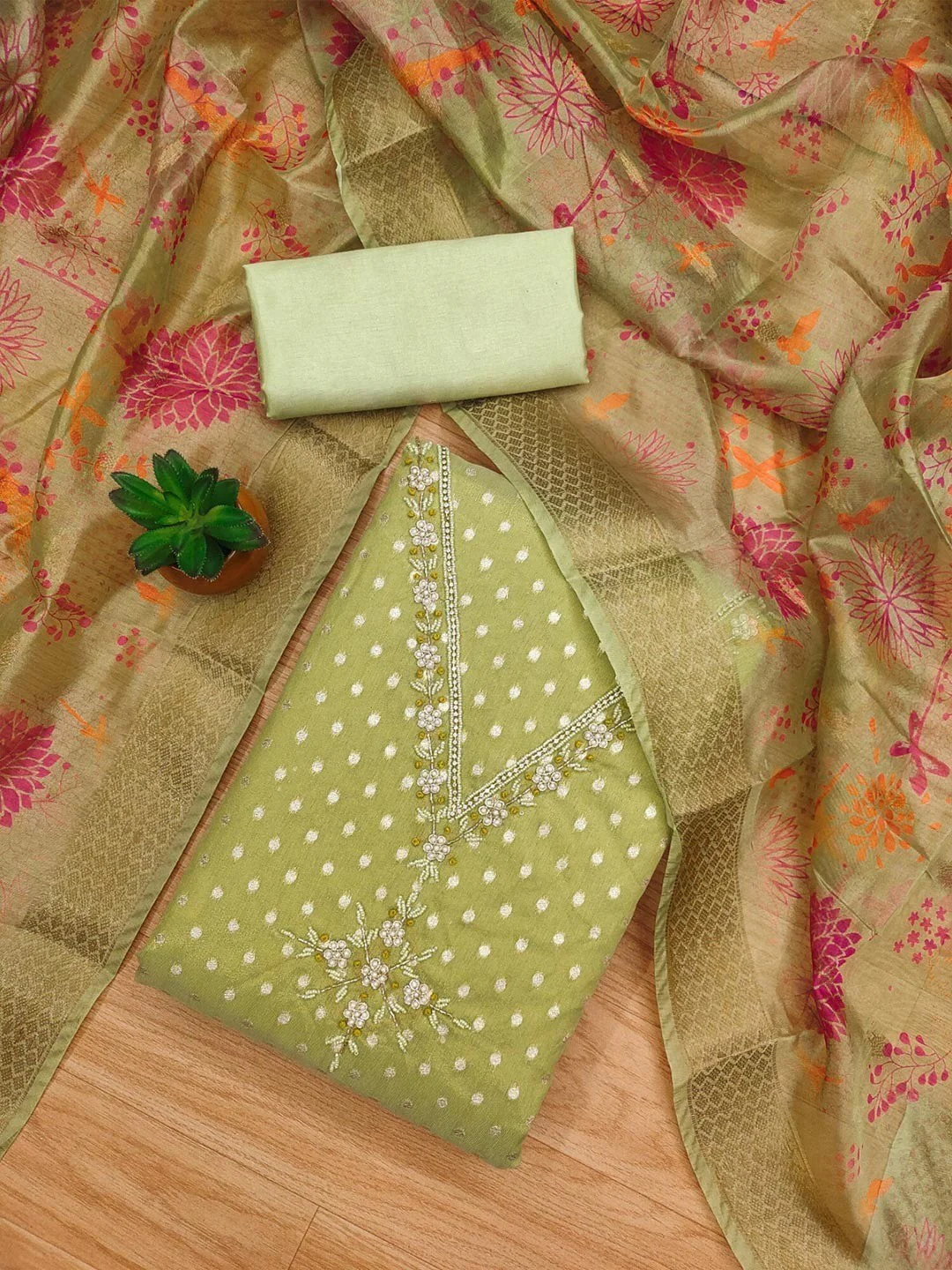 Luxury Green Woven Shimmer Dress Material Featuring Exquisite Moti Beads & Stone Embellishment