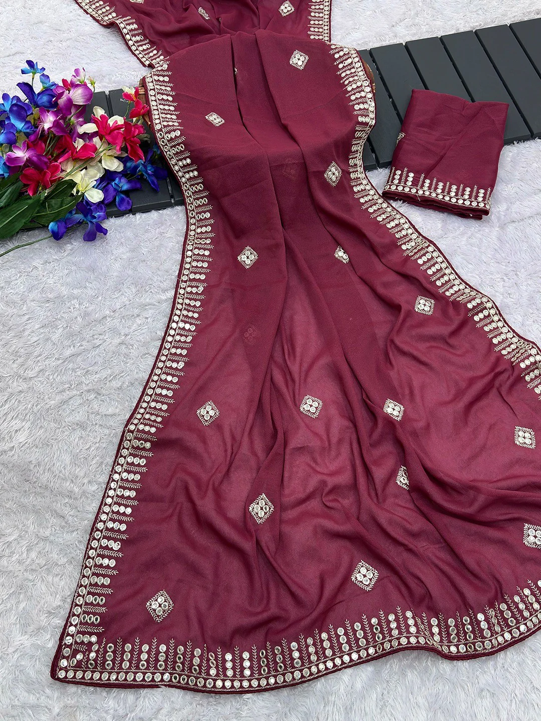 Charming Maroon Georgette Saree With Delicate Sequins Embroidery & A Beautiful Border