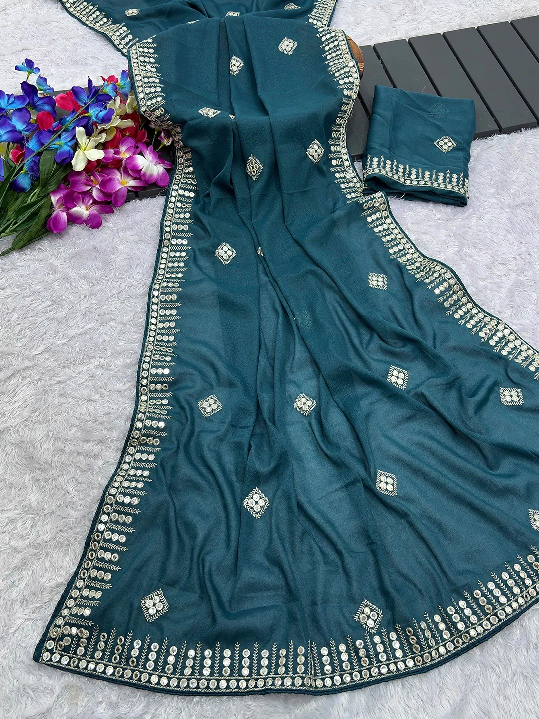 Charming Teal Blue Georgette Saree With Delicate Sequins Embroidery & A Beautiful Border