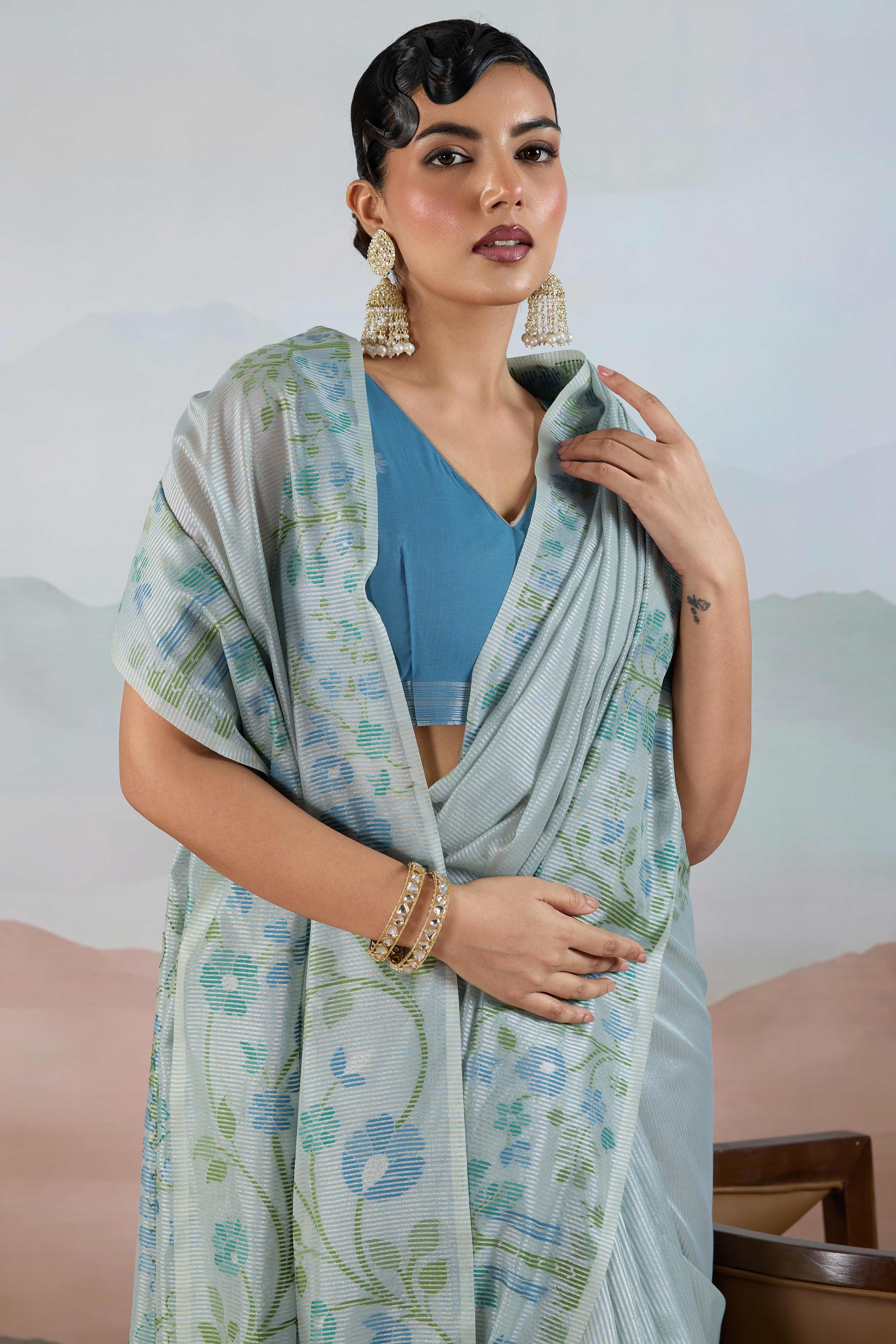 Blue Tissue Silk Saree Showcasing Floral & Striped Weaving With Tassel Adornment - Image 6