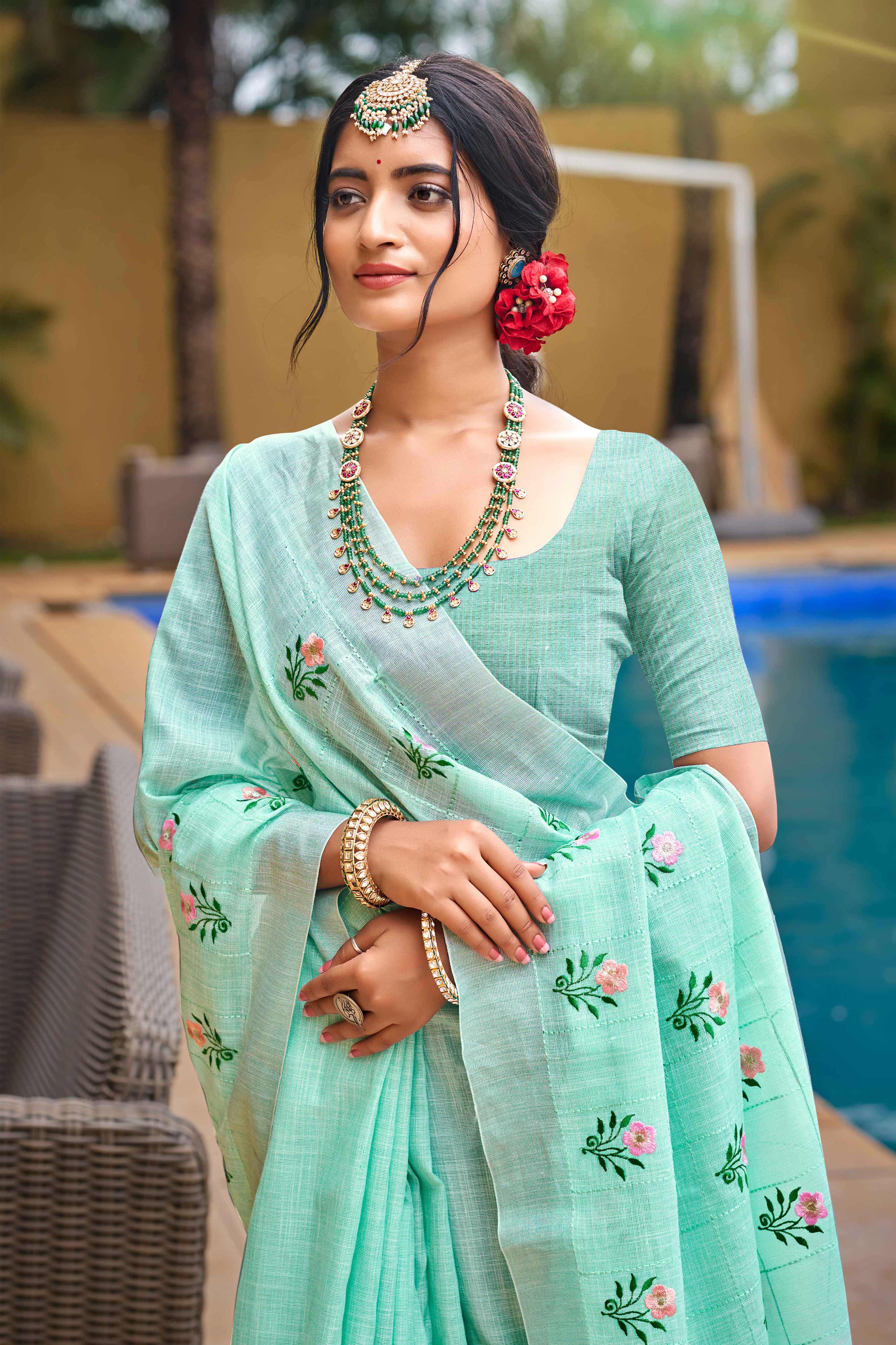 Captivating Turquoise Floral Thread Embroidered Linen Saree With Elegant Weaving Border - Image 3