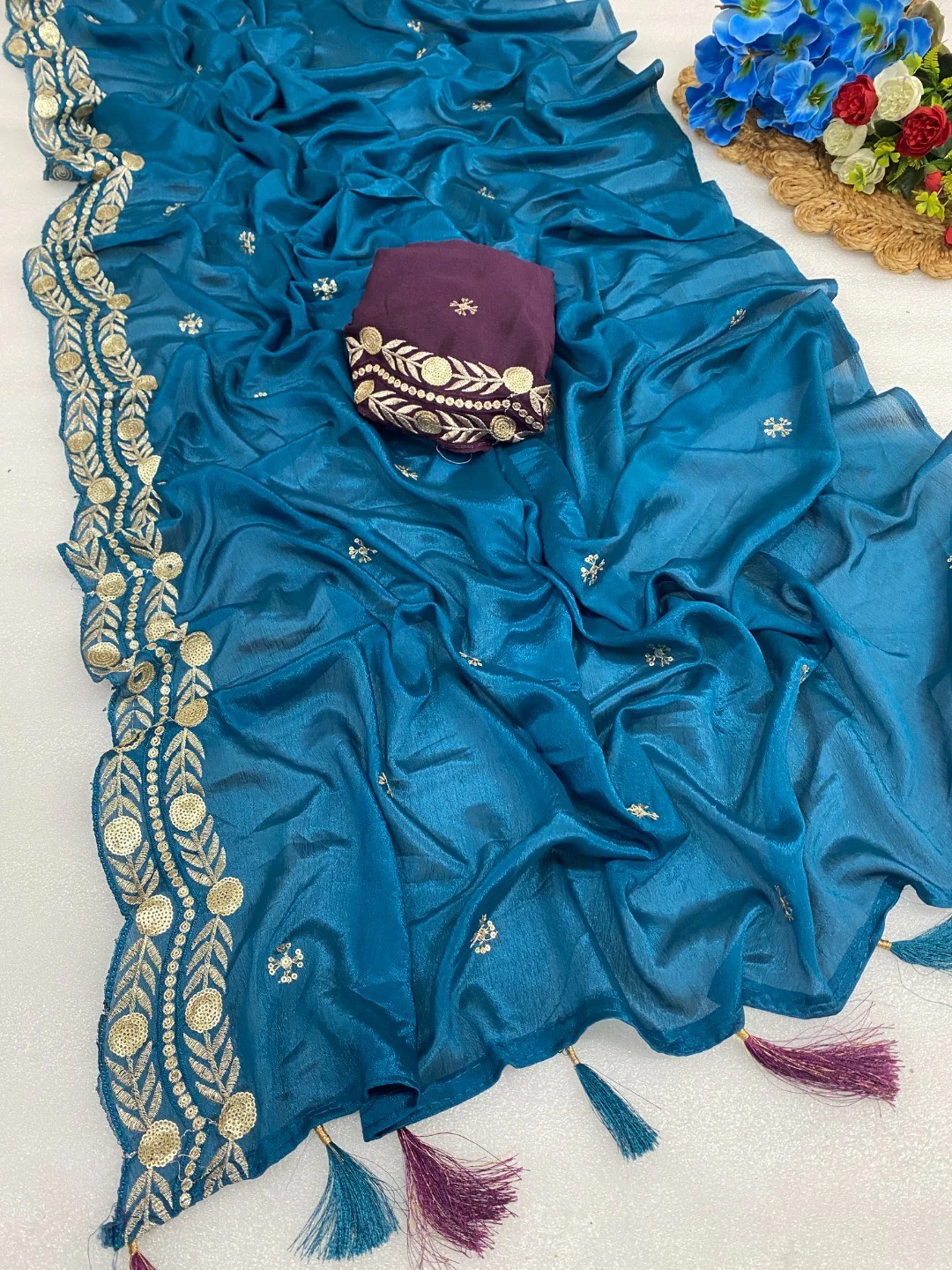 Charming Blue Georgette Saree Enhanced With Intricate Floral Sequins Embroidery