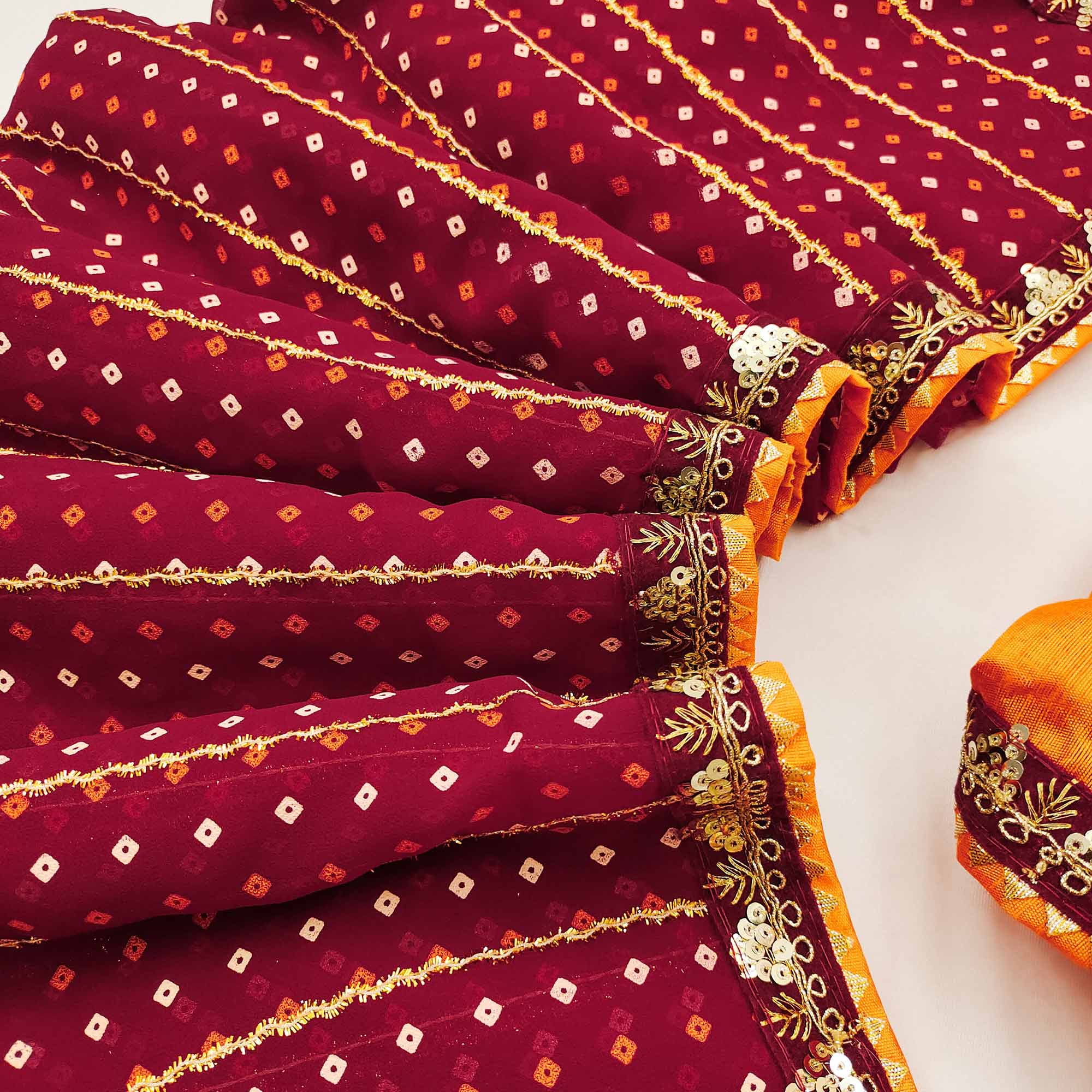 Charming Maroon Bandhani Printed Georgette Saree With Glittering Sequins & Zari Border - Image 3