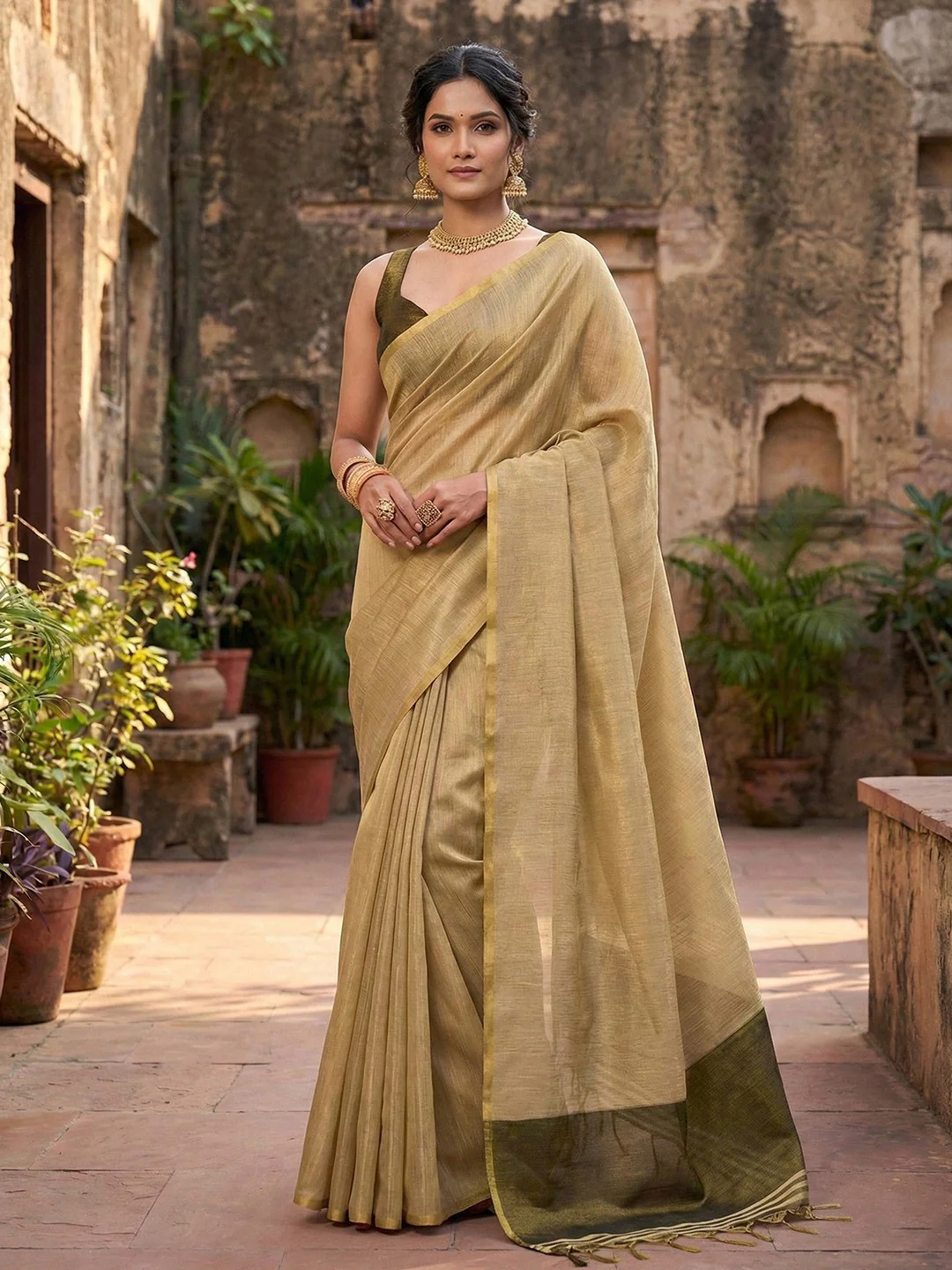Classic Cream Solid Tissue Silk Saree Featuring Intricate Zari Weaving & Tassel Pallu