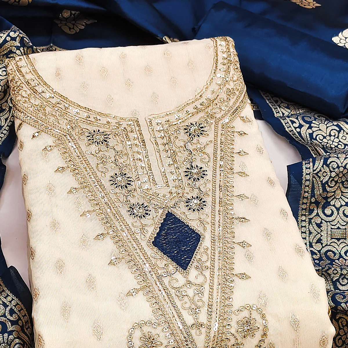 Cream & Blue Floral Butti Weaving With Intricate Cording Embroidered Shimmer Dress Material - Image 2