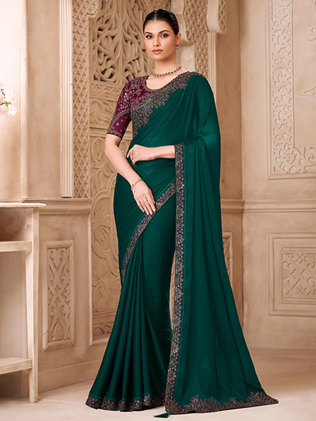 Dark Green Georgette Saree Featuring Detailed Embroidered Border