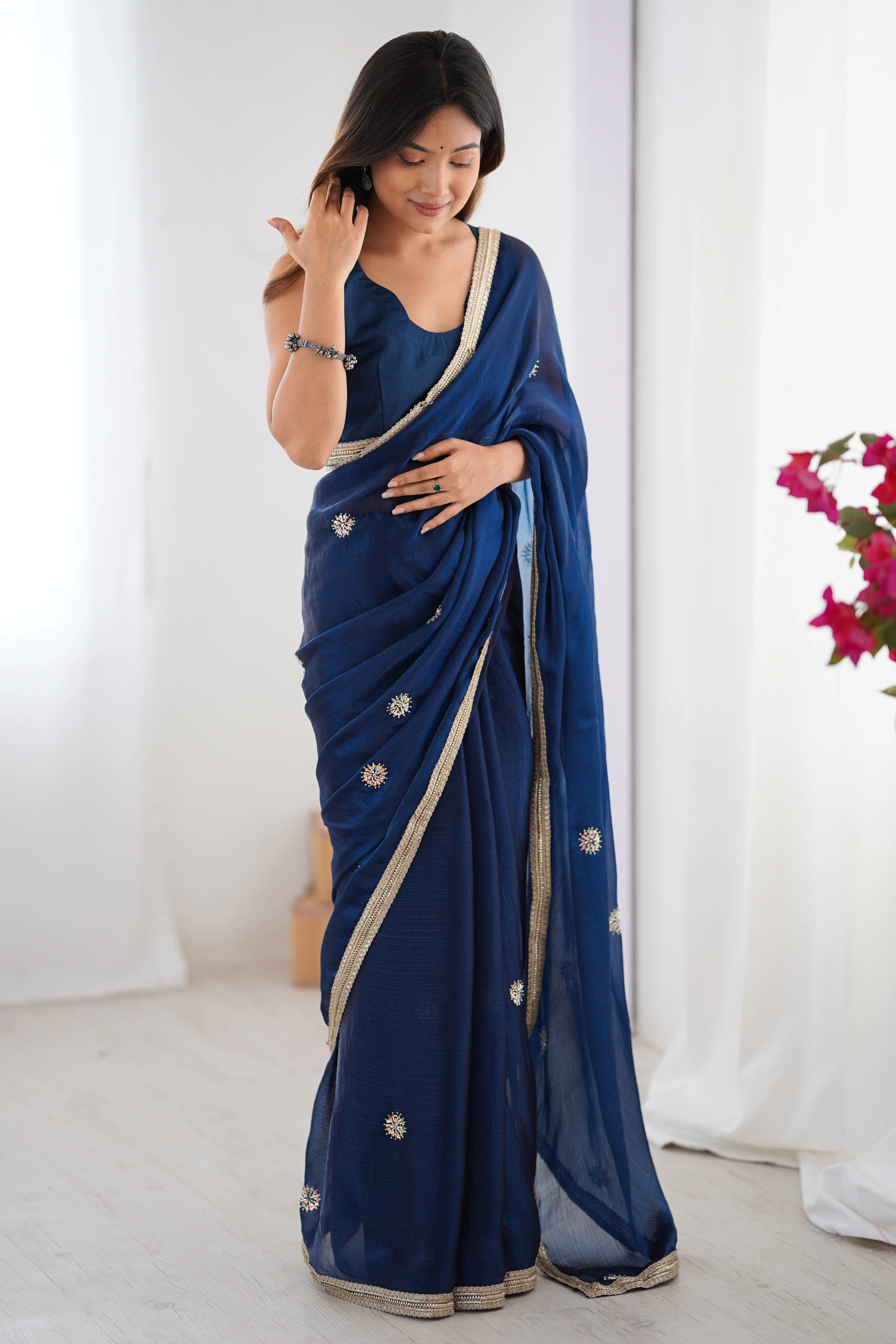 Elegant Blue Organza Saree with Delicate Floral Embellishments and Lace Border - Image 3
