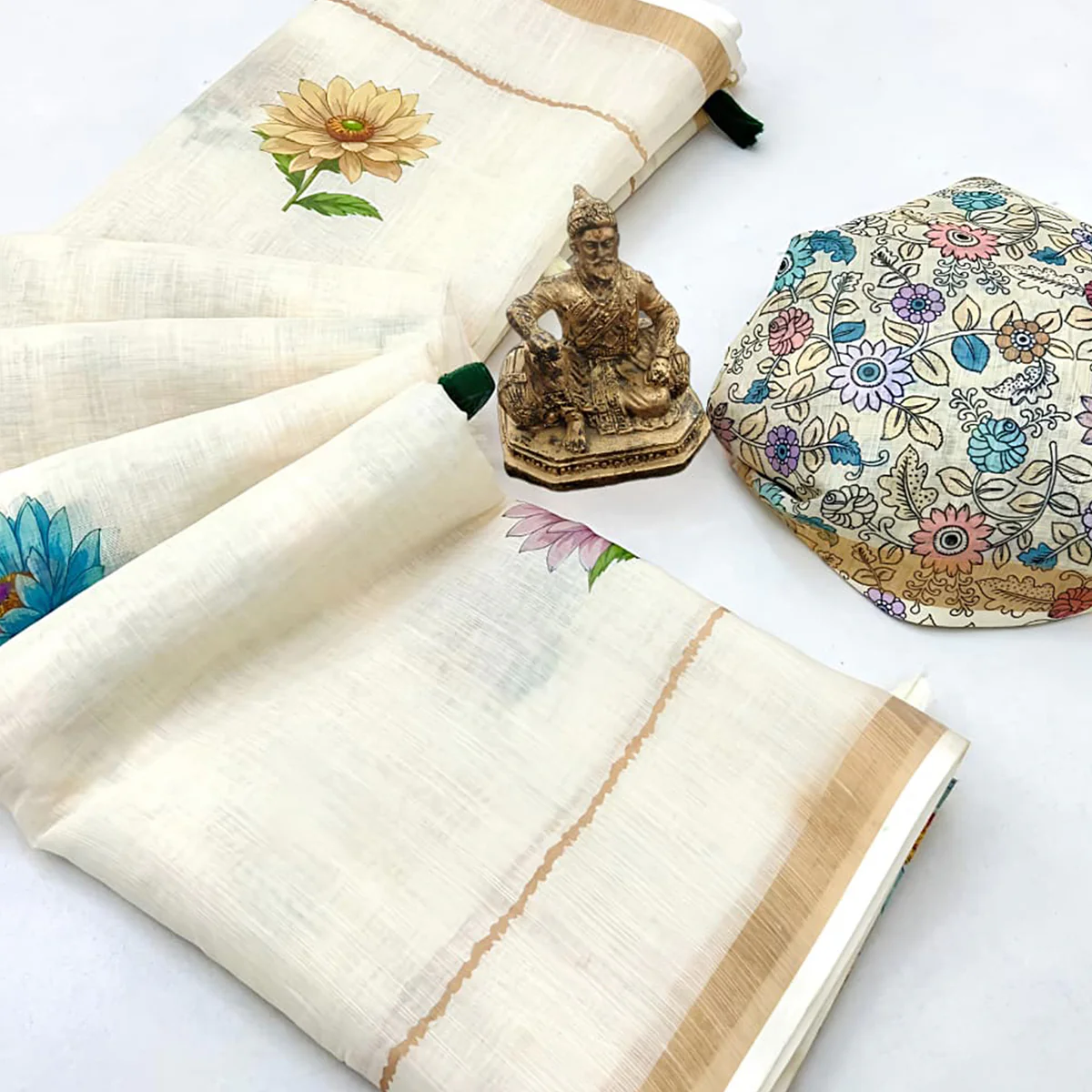 Elegant Cream Floral Digital Printed Linen Cotton Saree With Woven Border & Tassel Pallu - Image 2