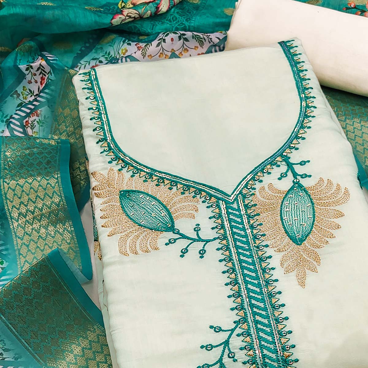 Elegant Cream & Turquoise Floral Embroidered Roman Cotton Silk Dress Material With Sequins Work - Image 2
