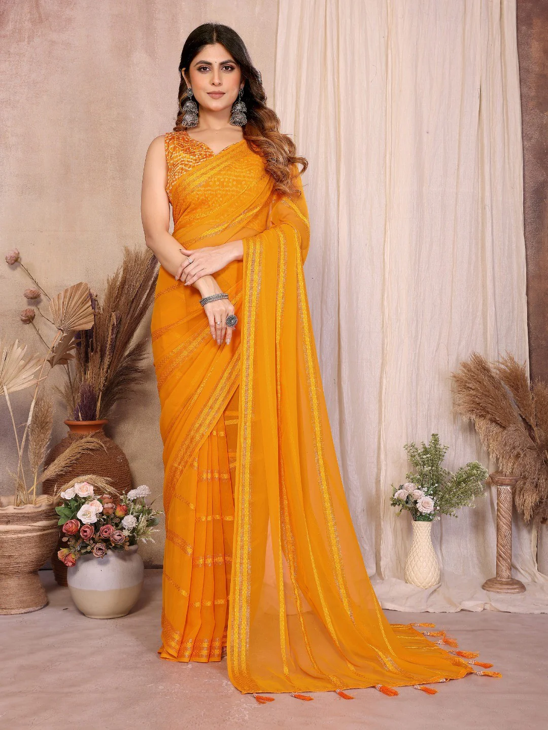 Elegant Mustard Zari Striped Weaving Georgette Saree Highlighted With Tassel Pallu