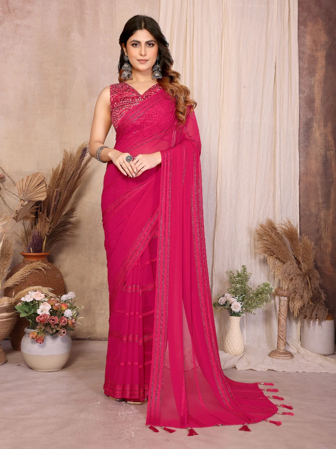 Elegant Pink Zari Striped Weaving Georgette Saree Highlighted With Tassel Pallu