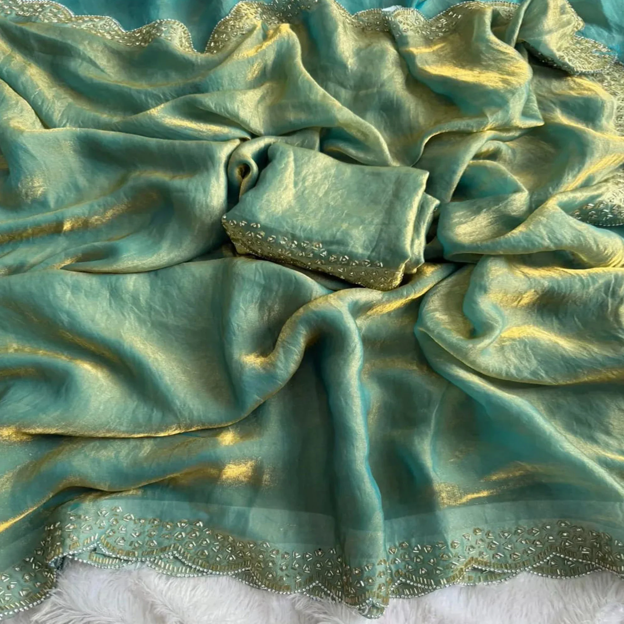 Elegant Sea Green Satin Saree Embellished in Gold Shine