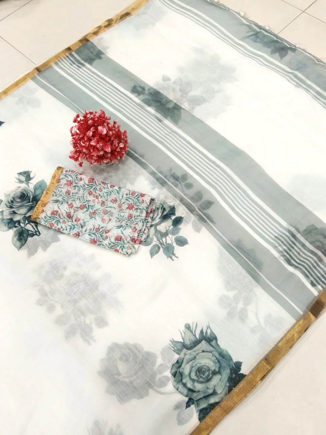 Elegant White Linen Saree with Floral Print and Golden Border - Image 2