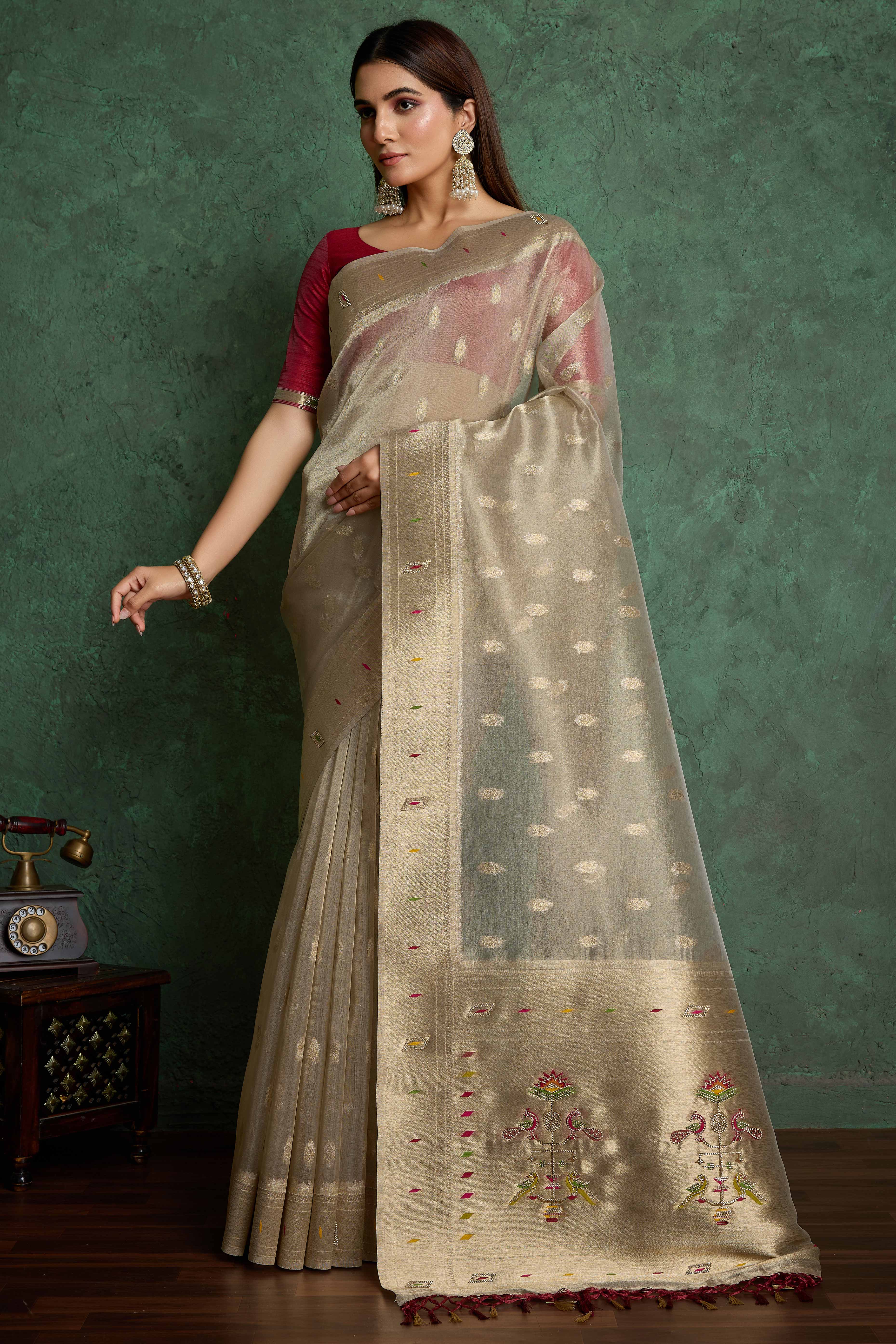 Graceful Beige Floral Woven Tissue Saree Adorned With Shimmering Jarkan Work & Tassel Pallu