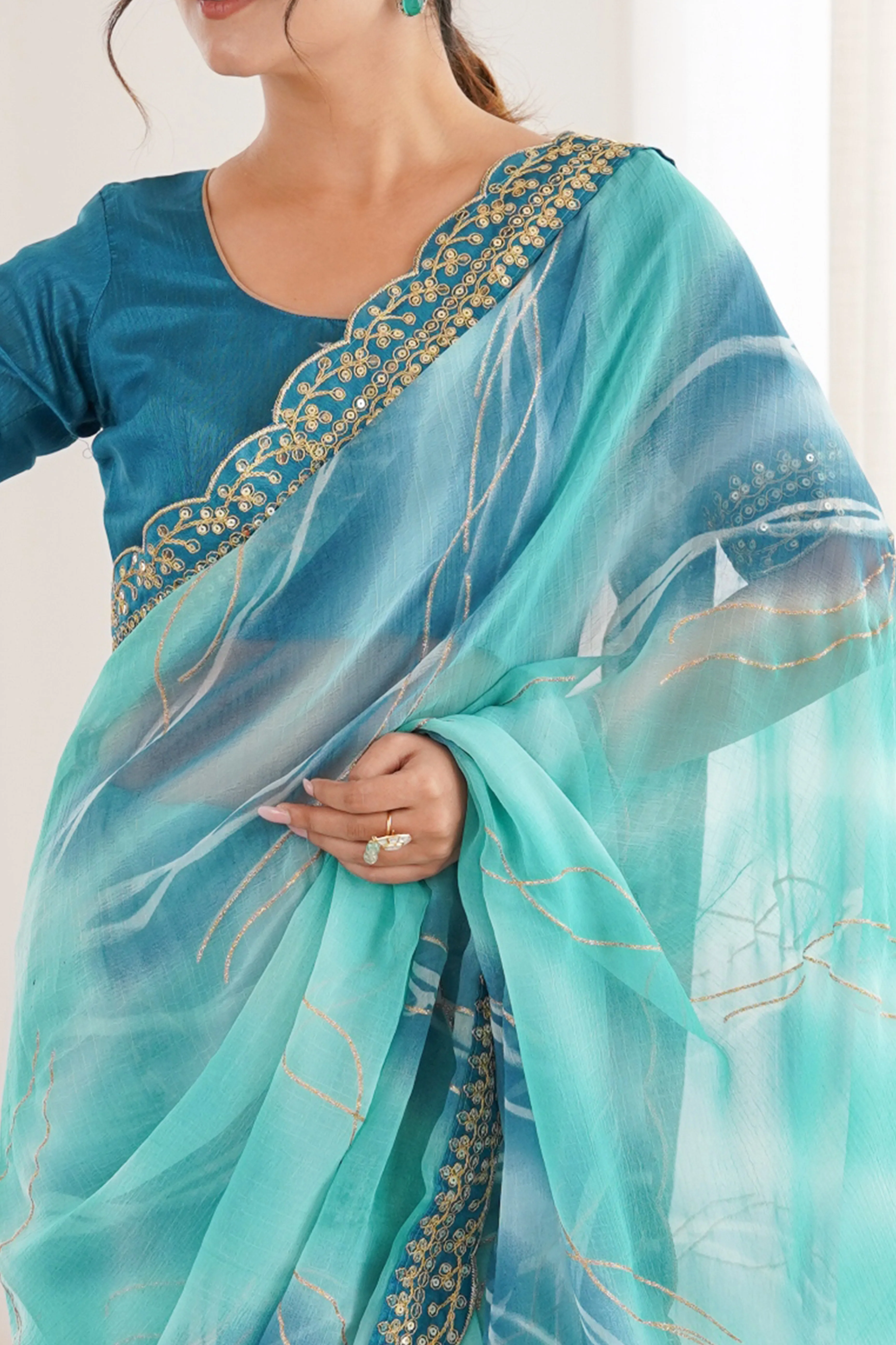 Graceful Blue Foil Print Georgette Saree Featuring A Luxurious Cording Sequins Embroidered Border - Image 2