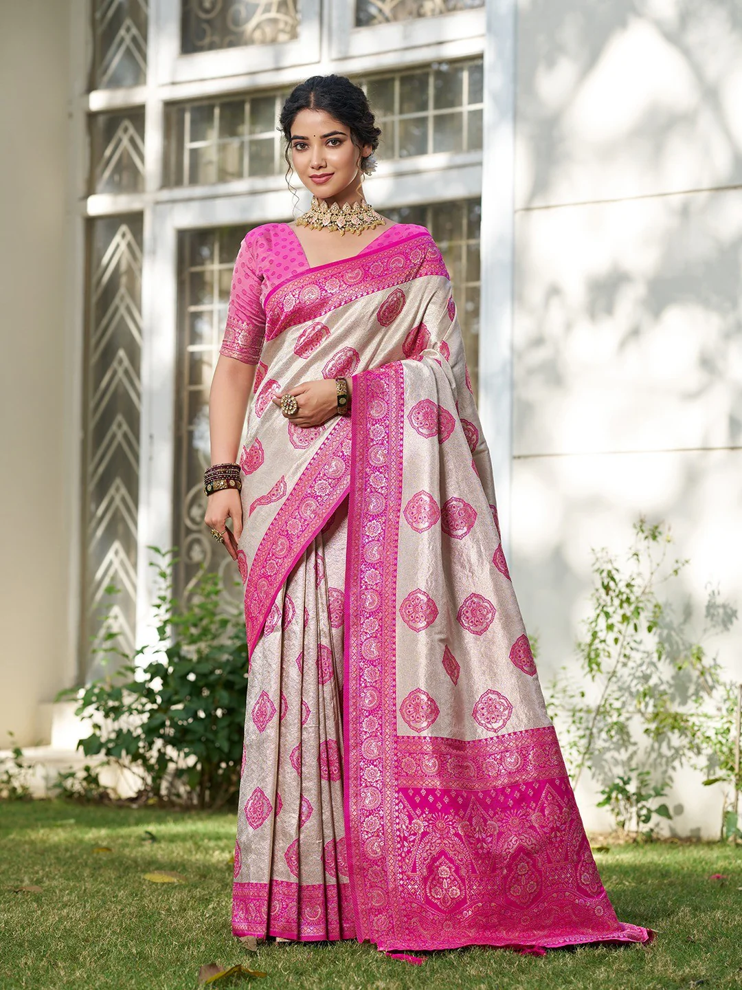 Graceful Cream & Rani Pink Floral Weaving Silk Blend Saree Enhanced With Designer Tassel Pallu