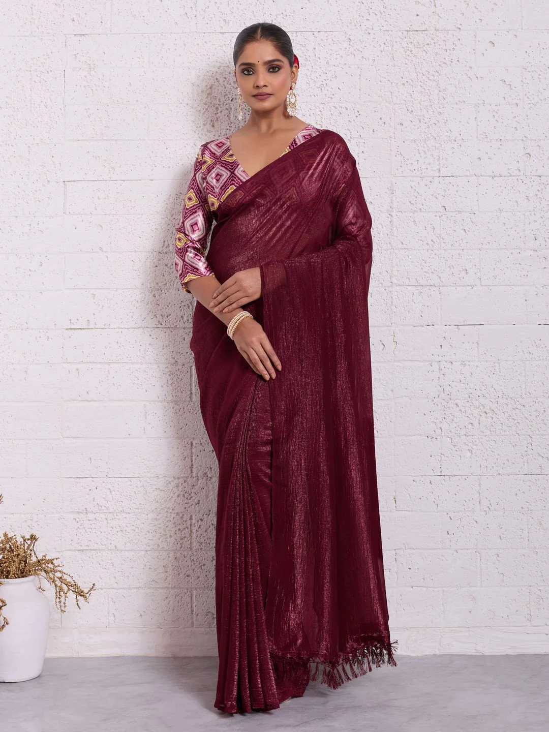 Graceful Dark Maroon Solid Pure Crunchy Saree Accented With Fine Tassel Pallu