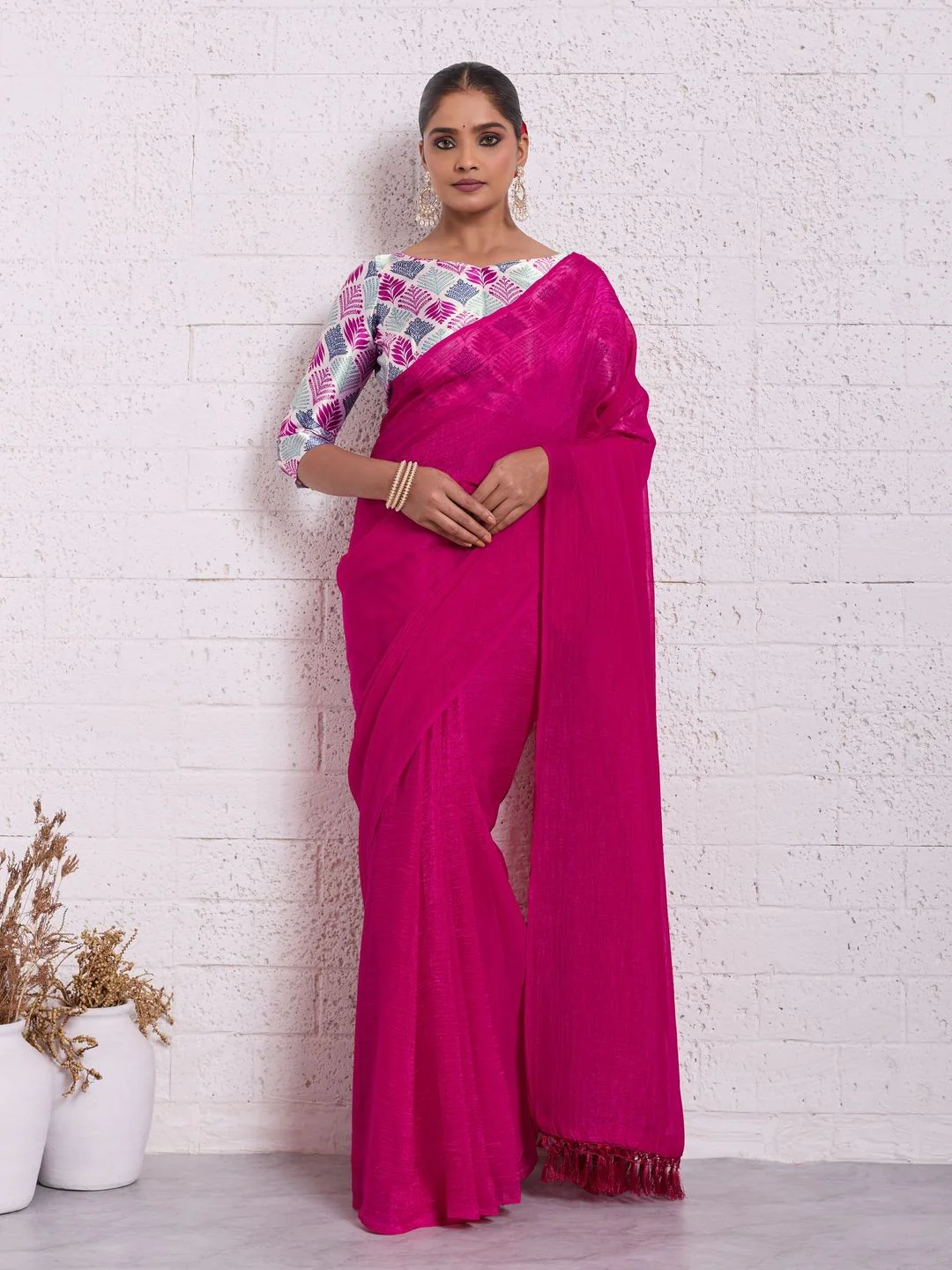 Graceful Pink Solid Pure Crunchy Saree Accented With Fine Tassel Pallu
