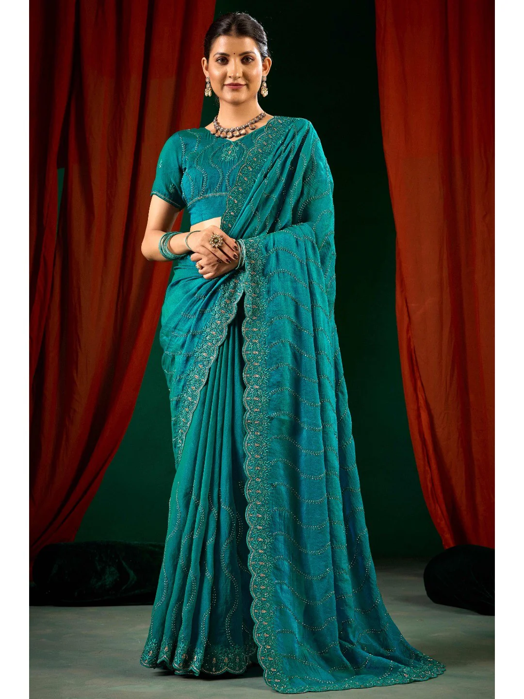 Graceful Teal Green Georgette Silk Saree with Delicate Embroidery