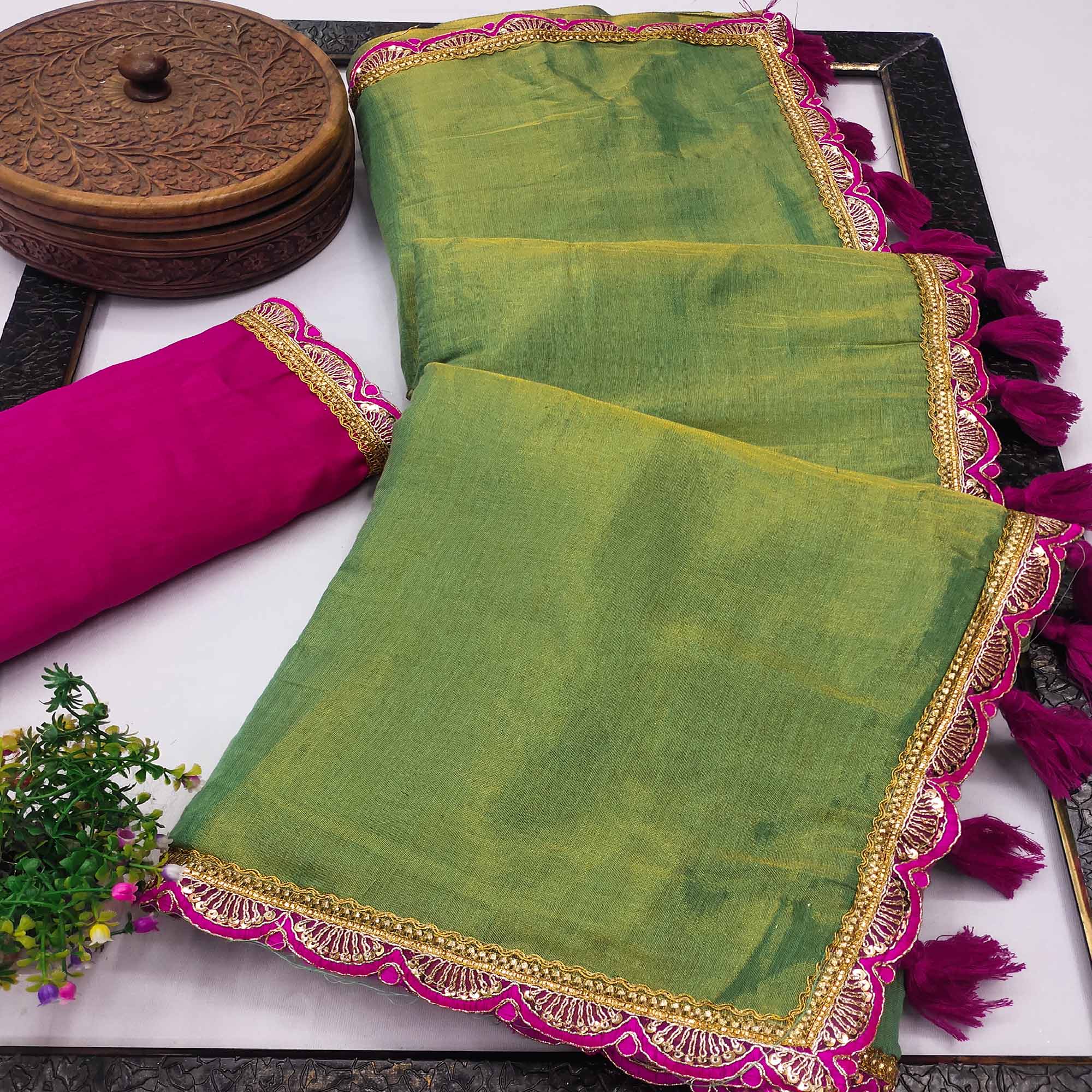 Green Beige Solid Tissue Saree Enhanced With Graceful Embroidered Lace Border Work