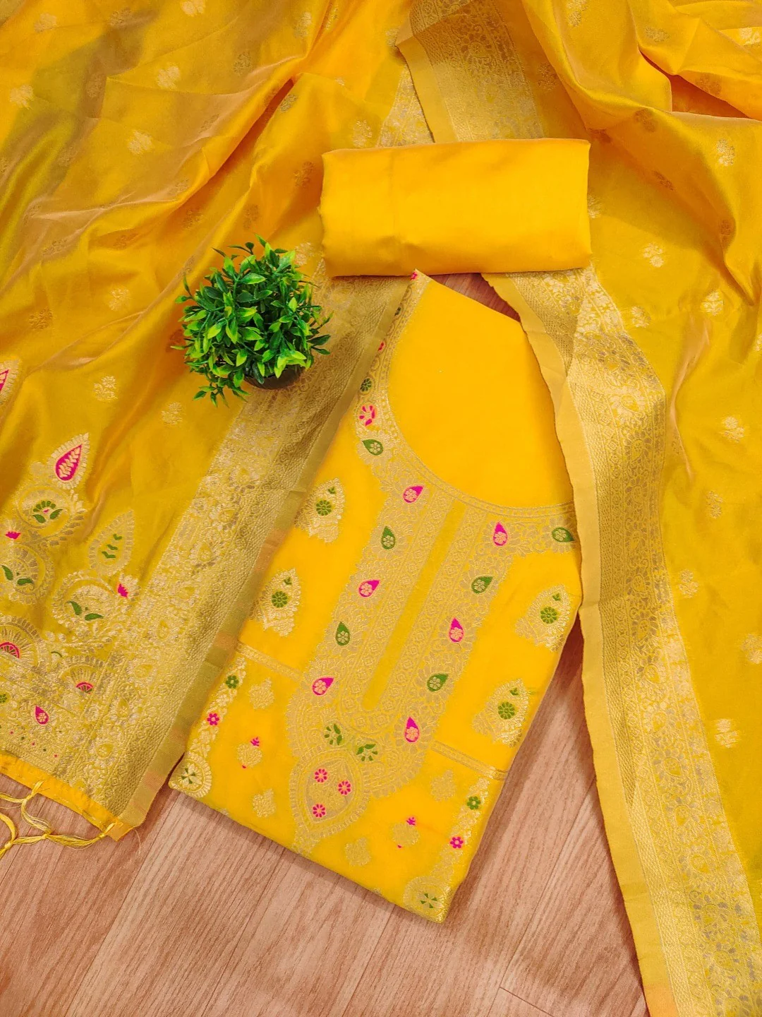 Luxurious Yellow Banarasi Silk Dress Material Showcasing Rich Floral Zari Weaving Design