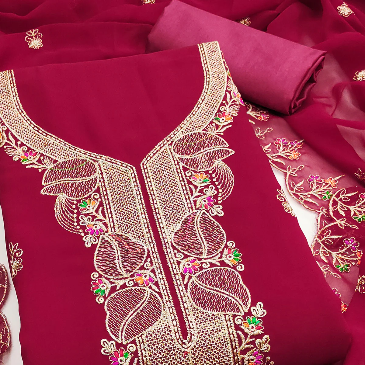 Rani Pink Georgette Dress Material Adorned With Floral Embroidery & Elegant Lace Border - Image 2