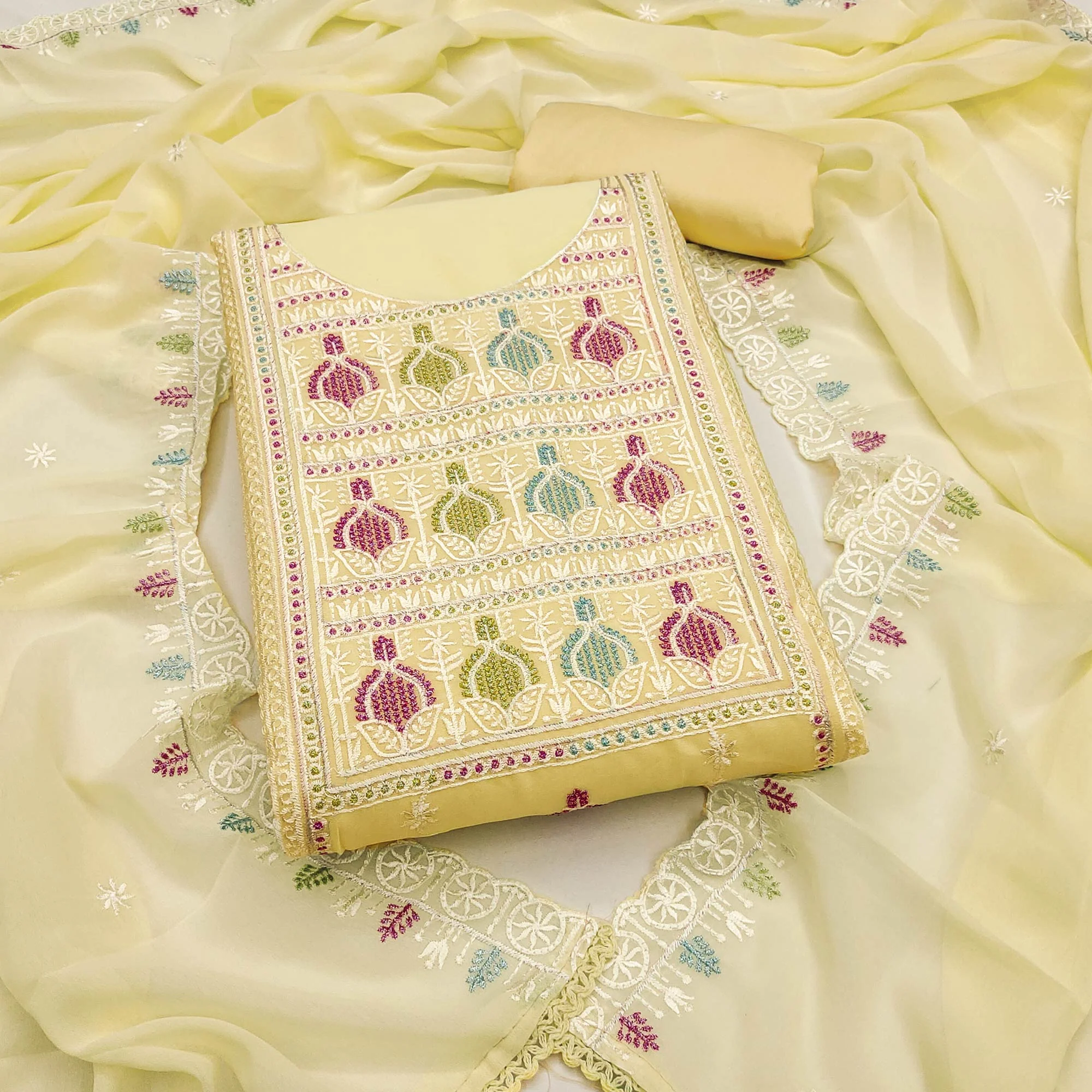 Sophisticated Yellow Georgette Dress Material Accented With Ornate Floral Thread Embroidery