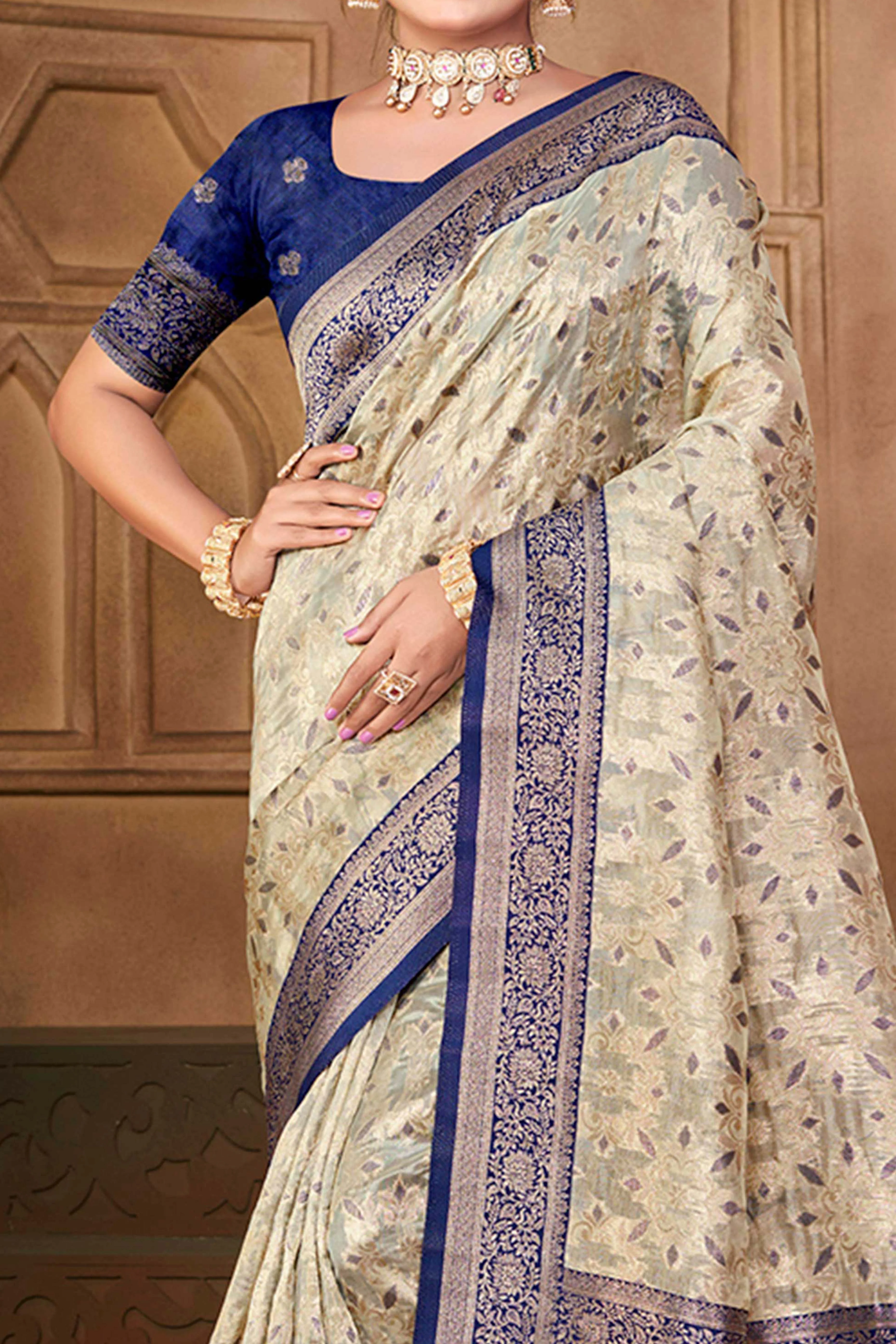 Stunning Beige & Navy Blue Floral Weaving Silk Blend Saree Enhanced With A Stylish Tassel Pallu - Image 2