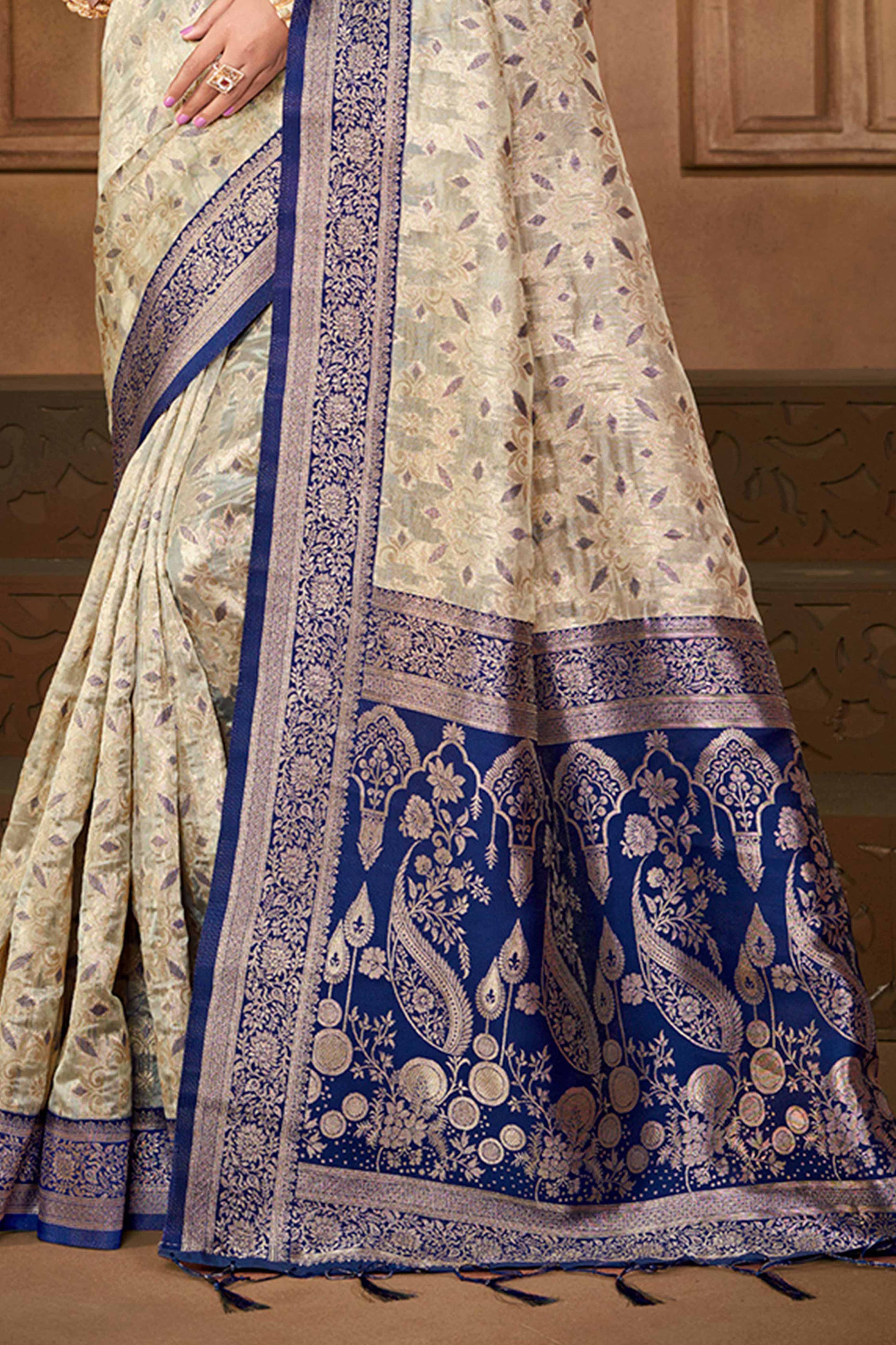 Stunning Beige & Navy Blue Floral Weaving Silk Blend Saree Enhanced With A Stylish Tassel Pallu - Image 4