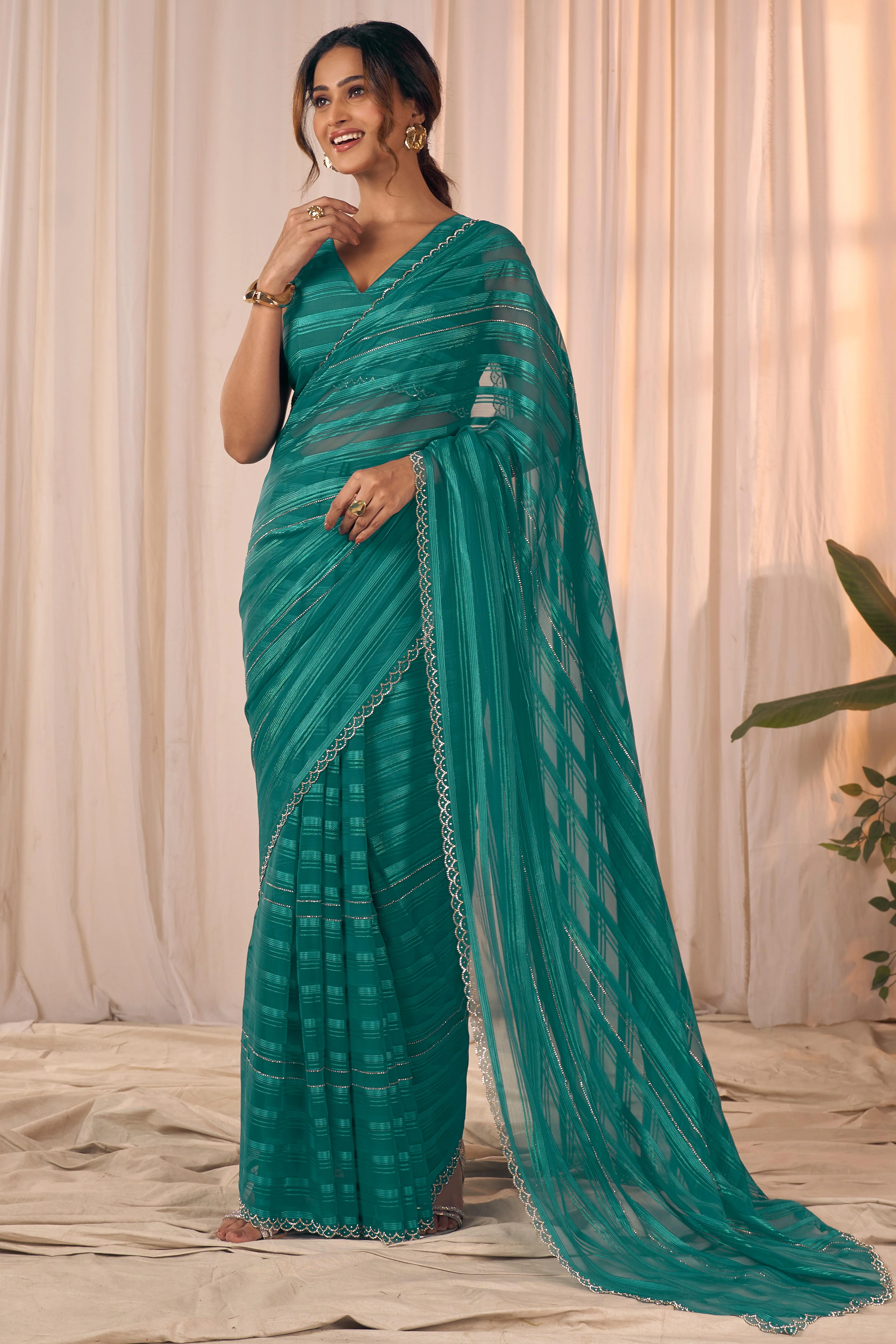 Teal Striped Designer Georgette Saree Adorned With An Elegant Zarkan Cutwork Border - Image 3