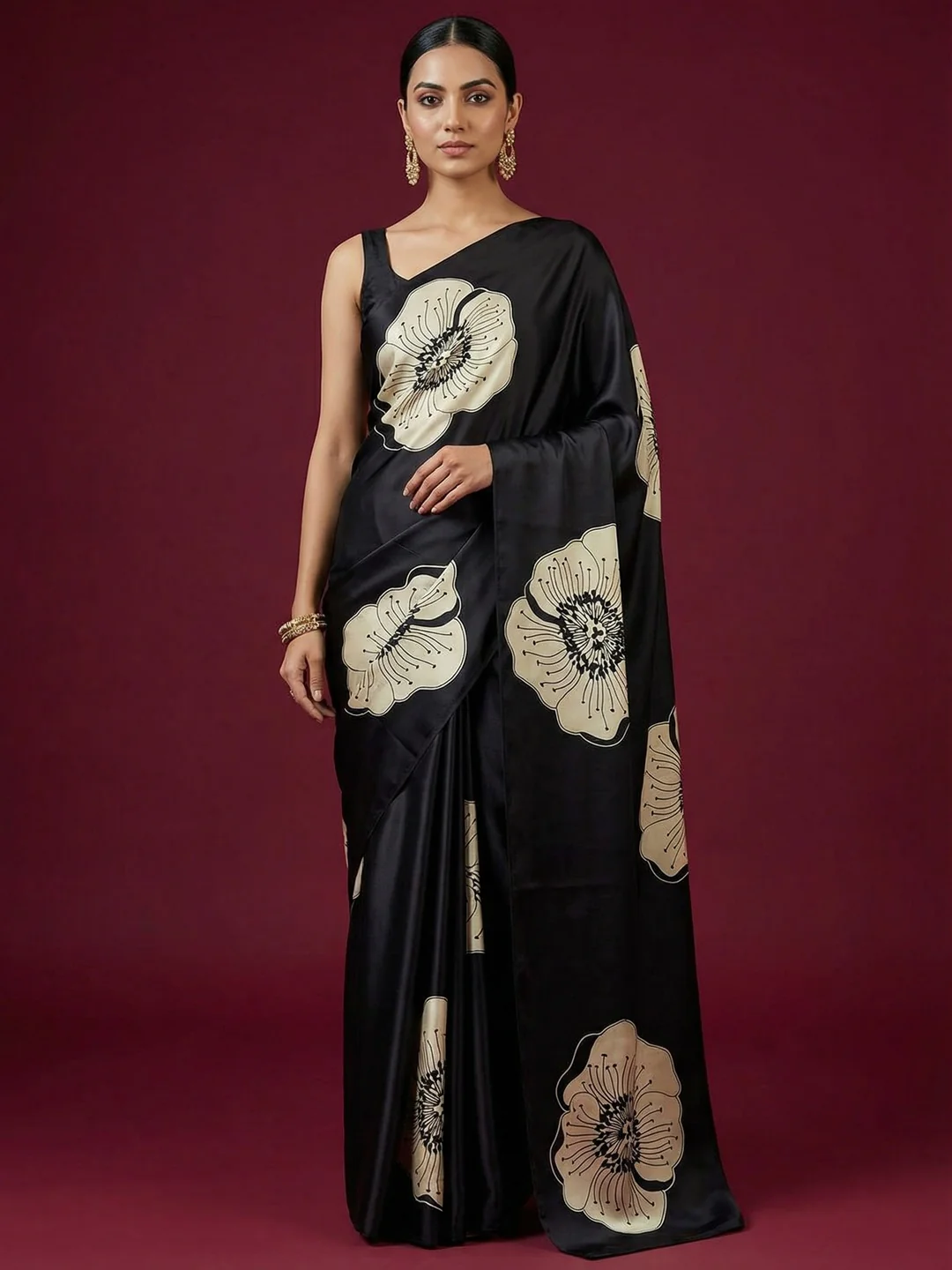 Timeless elegance in this black satin saree adorned with delicate floral prints