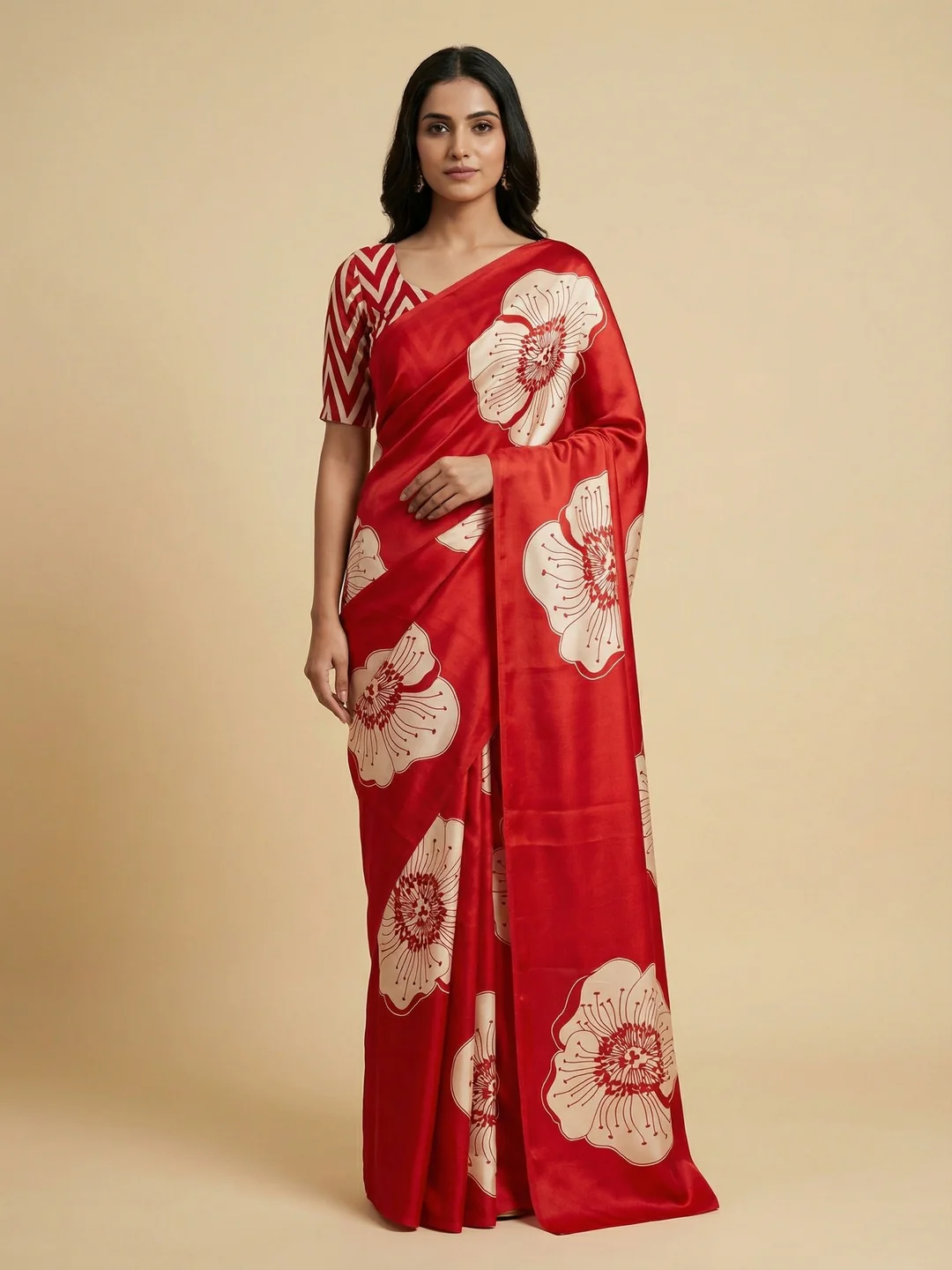 Timeless elegance in this red satin saree adorned with delicate floral prints.
