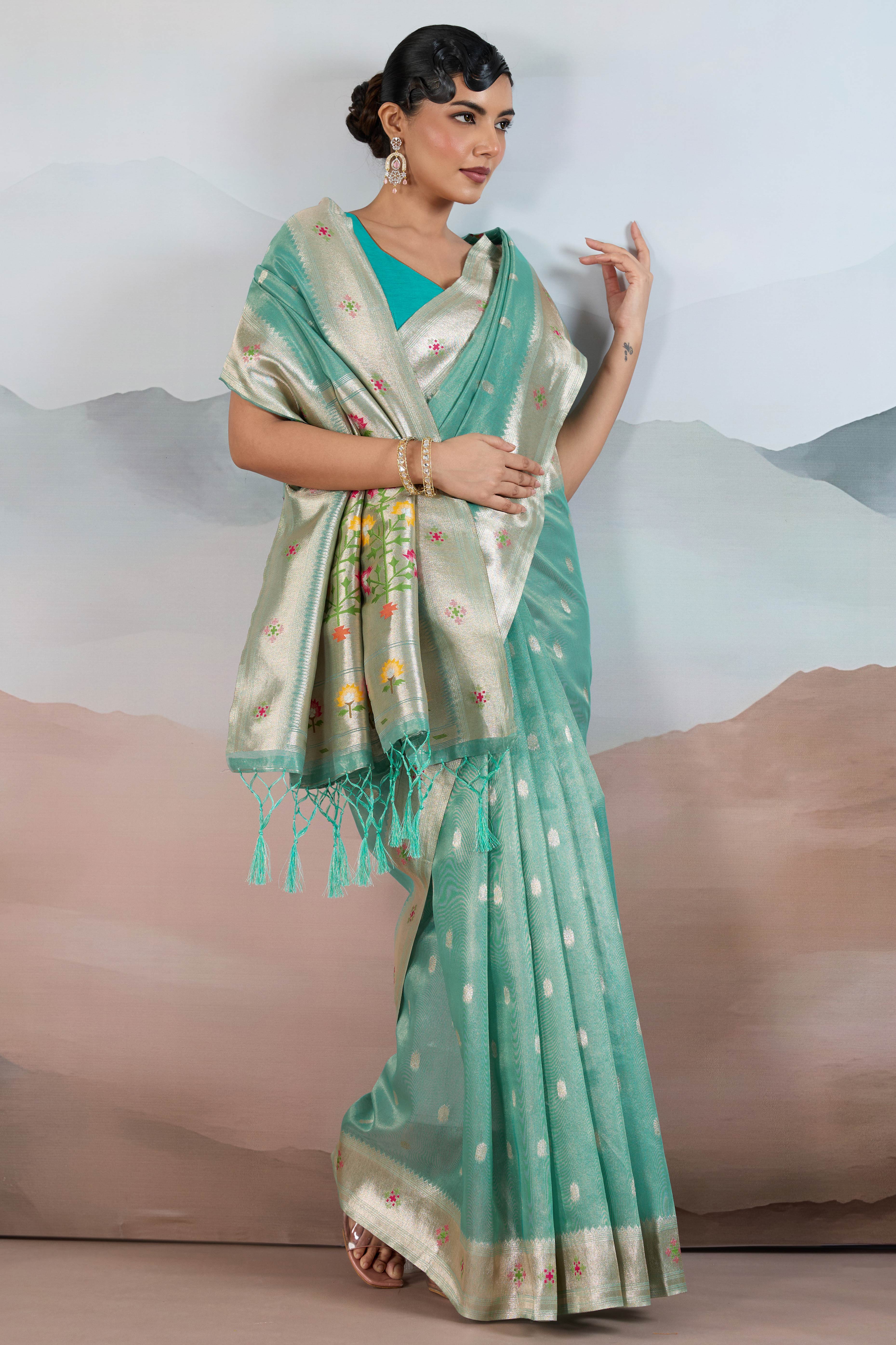 Turquoise Festive Tissue Saree Crafted with Artistic Zari Butti Weaving and a Featherlight Texture - Image 3