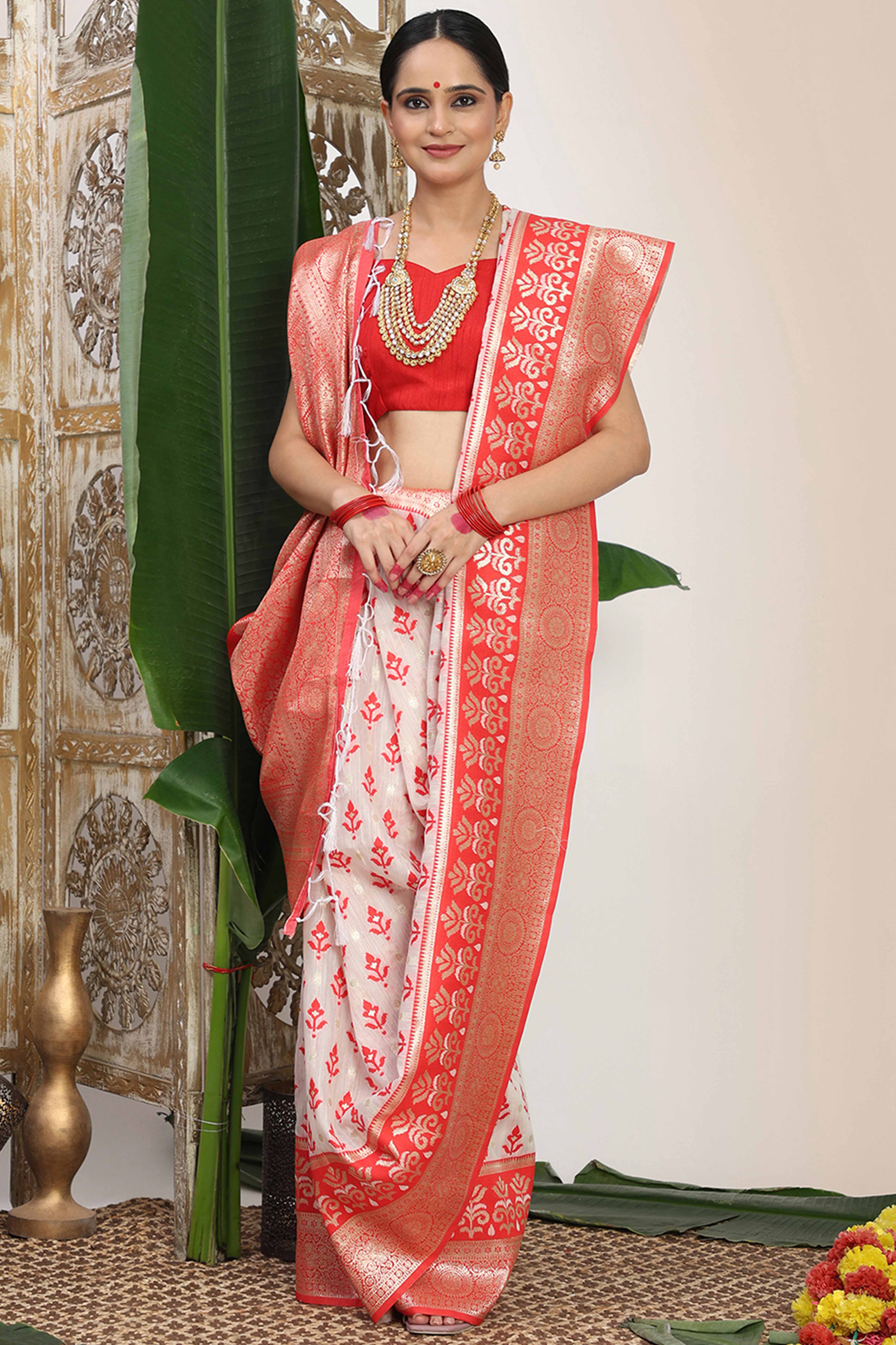 White & Red Linen Cotton Saree Showcasing Elegant Zari Weaving And A Tassel-Embellished Pallu - Image 3