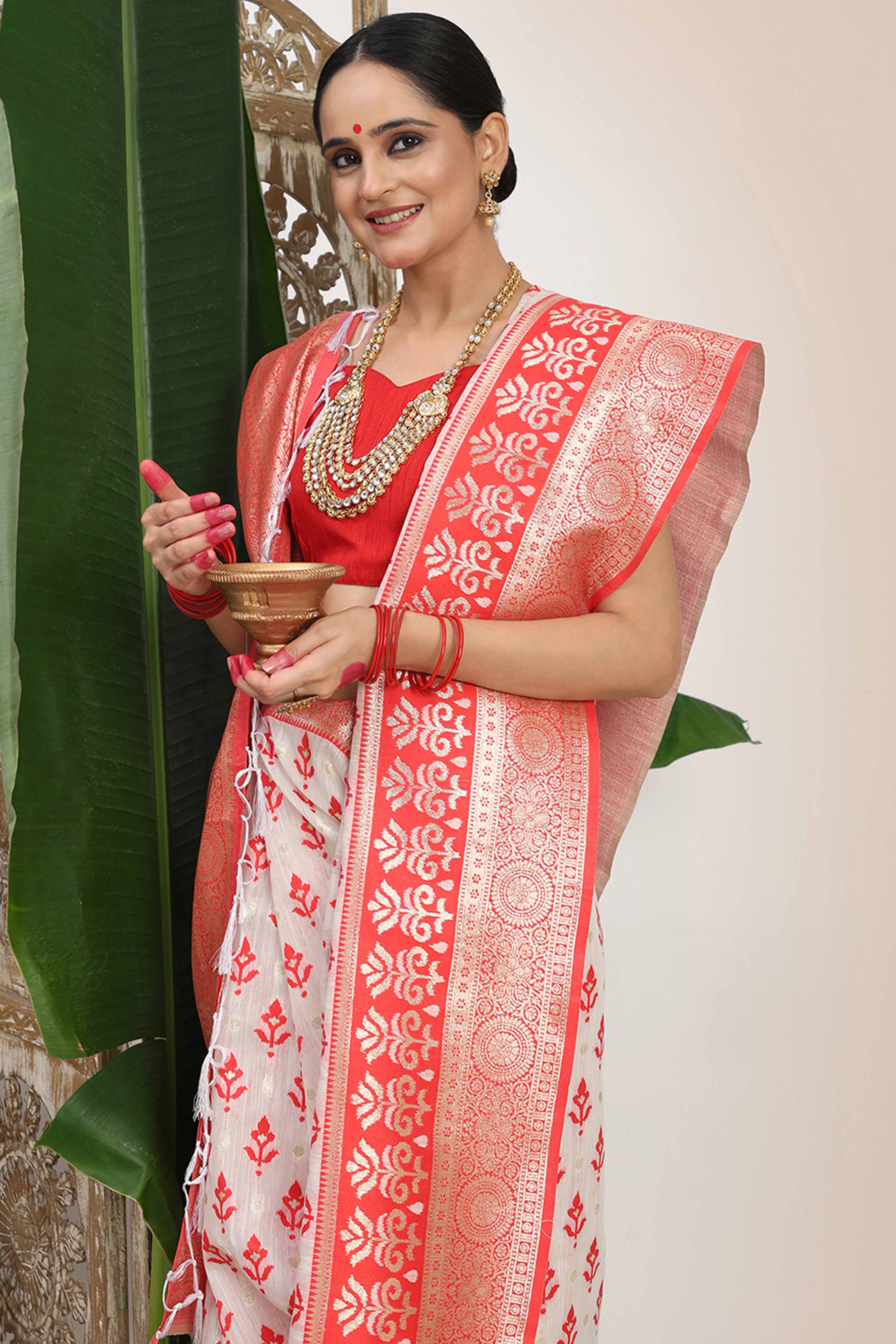 White & Red Linen Cotton Saree Showcasing Elegant Zari Weaving And A Tassel-Embellished Pallu - Image 7