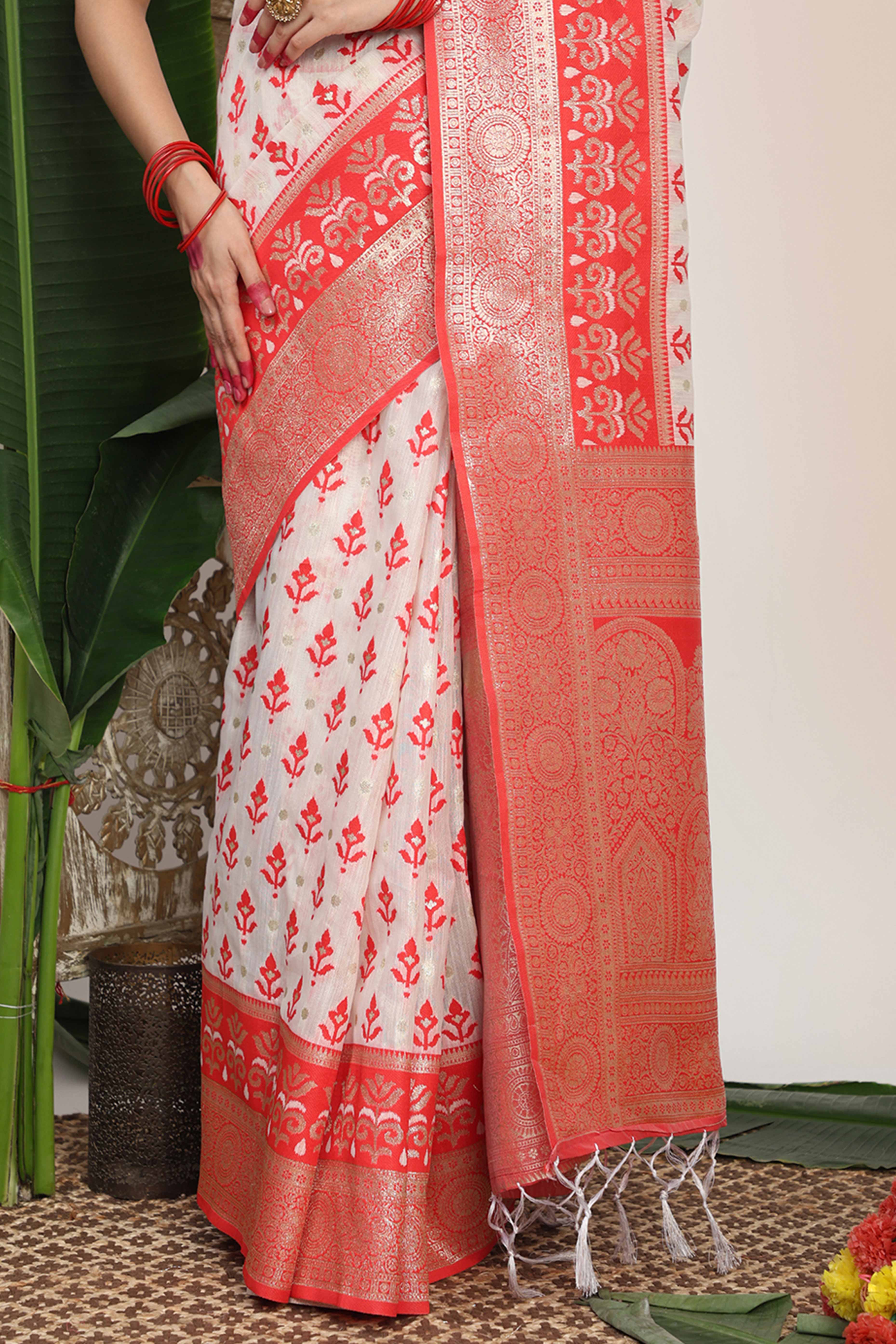 White & Red Linen Cotton Saree Showcasing Elegant Zari Weaving And A Tassel-Embellished Pallu - Image 9