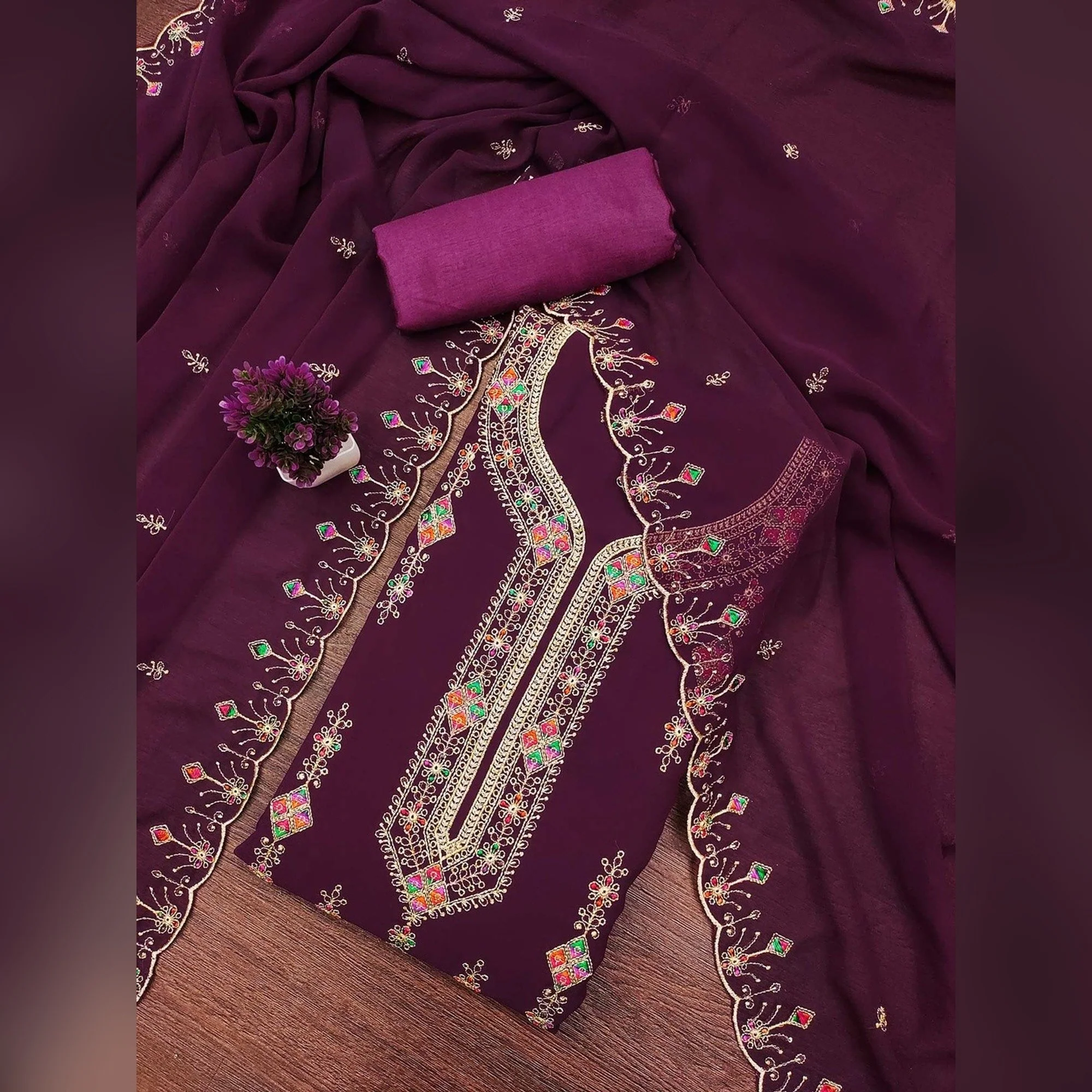 Wine Georgette Dress Material Enhanced With Graceful Floral Embroidery For An Elegant Ethnic Look